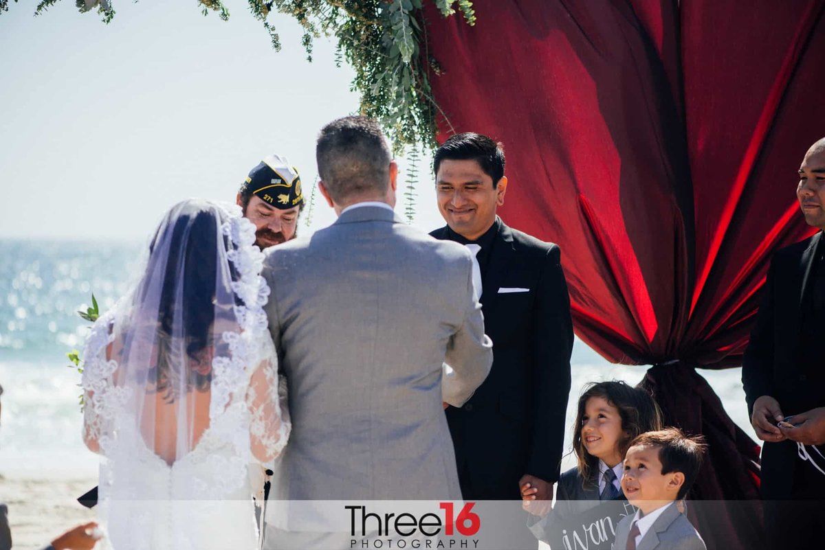 Bride's Son hands off the Bride to her new Groom