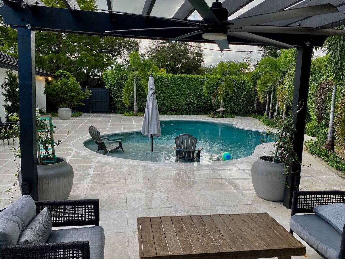 View of swimming pool from pergola