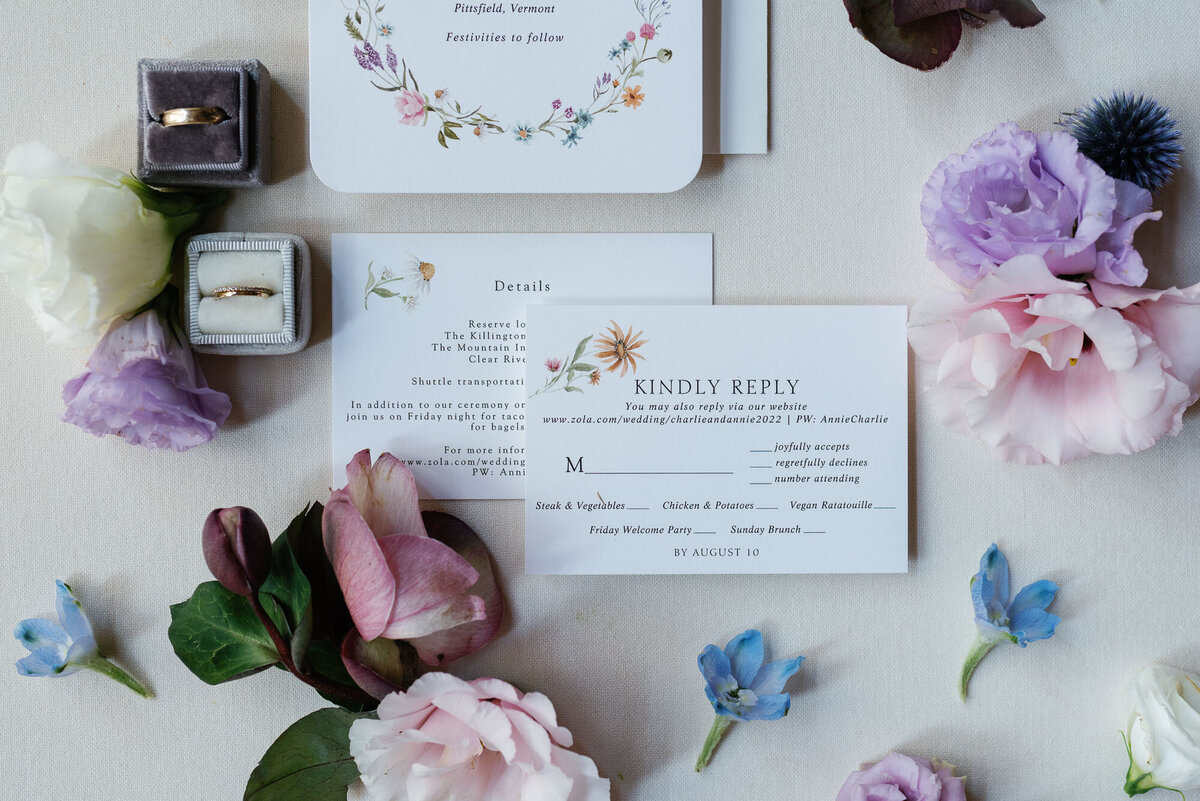 august and white wedding invitation at riverside farm with pastel florals