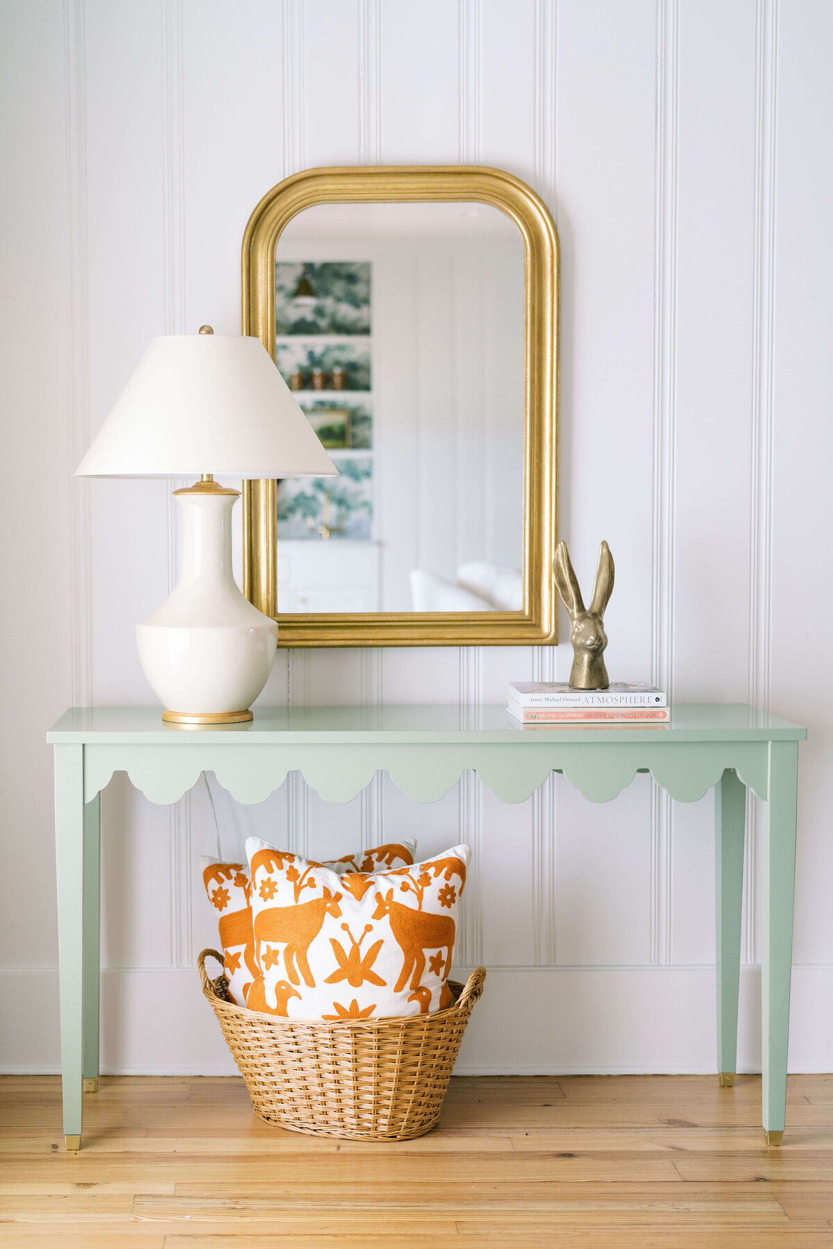oyster creek studios happy valley green side table with light lamp with a wicker basket with pillows