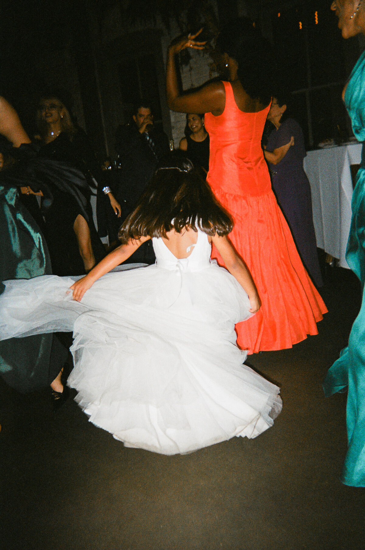 a documentary photo of a little girl dancing at a wedding reception captured on 35mm film by Los Angeles wedding photographer 