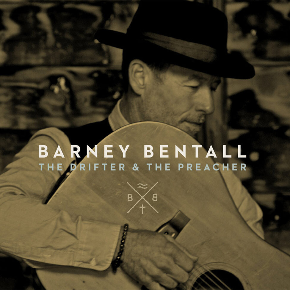 Album Cover Title The Drifter And The Preacher Artist Barney Bentall holding acoustic guitar wearing black fedora black and white portrait toned yellowish brown