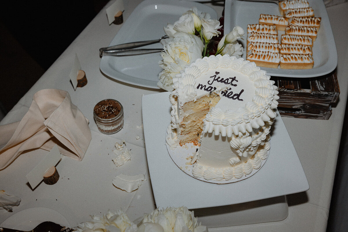 Late night flat lay of cake after newlywed cake cutting