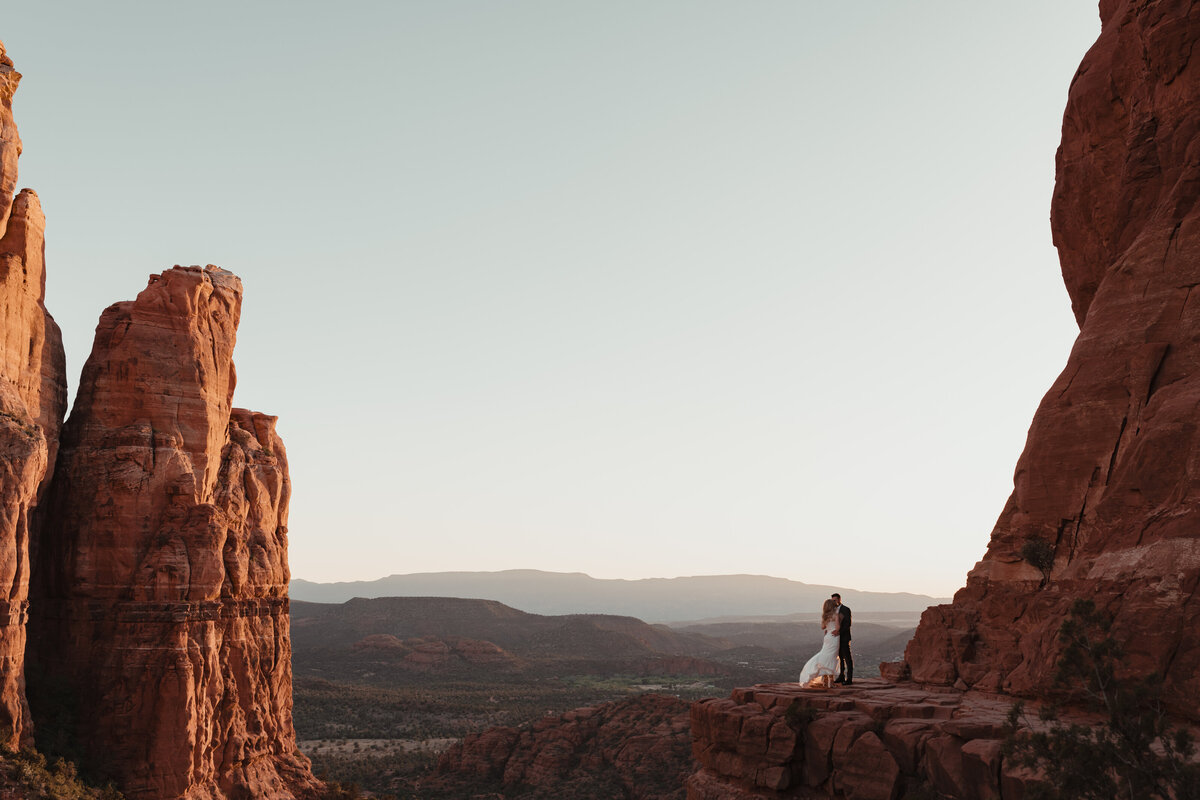 Final kiss under golden Sedona sky Cathedral Rock elopement taken by Kollar Photography