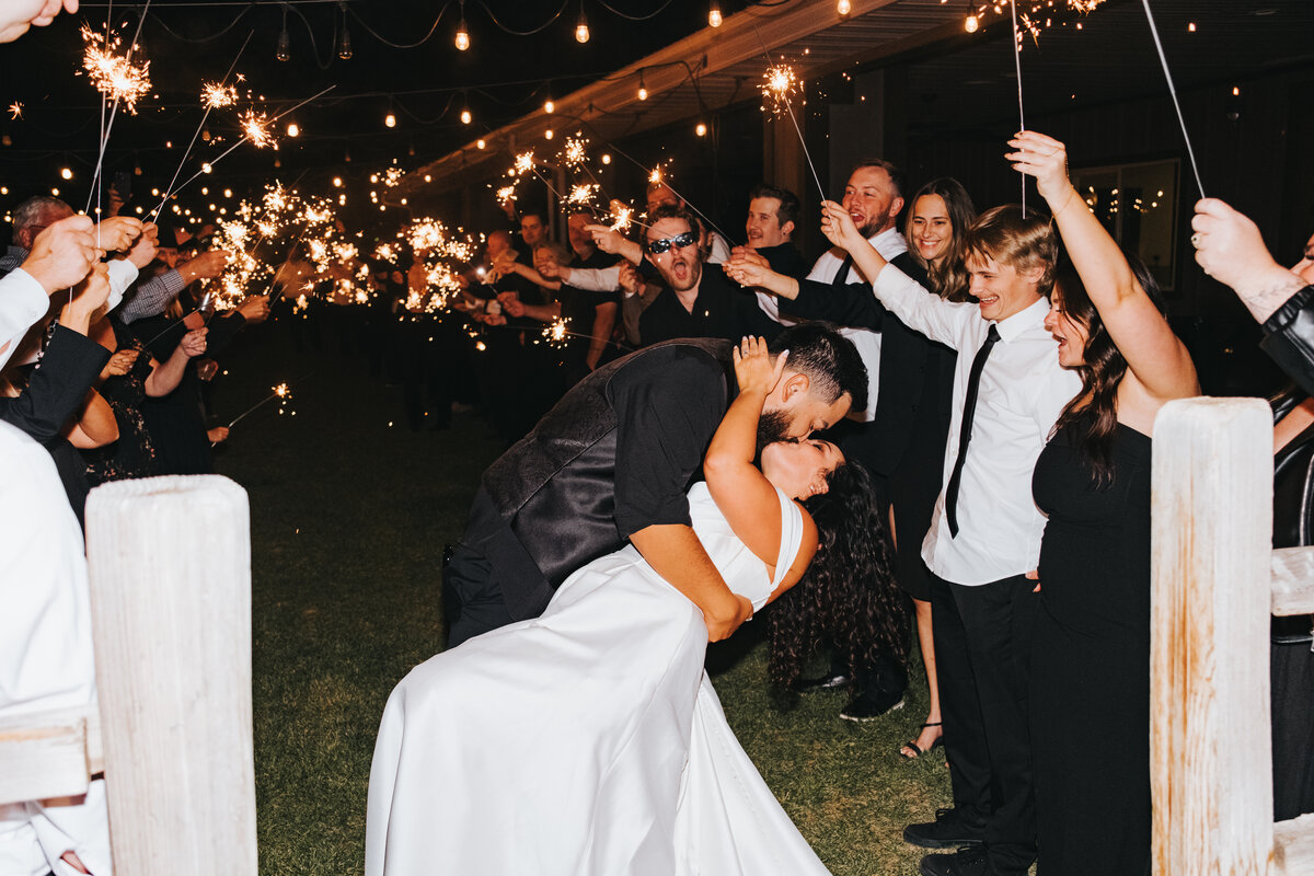 Sparkler send-off with a dip kiss