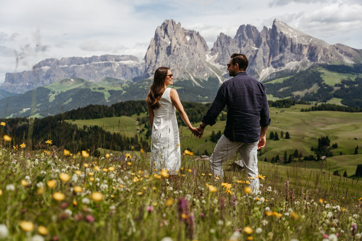 sweet couple intimate Alpe di Siusi mountain meadow view