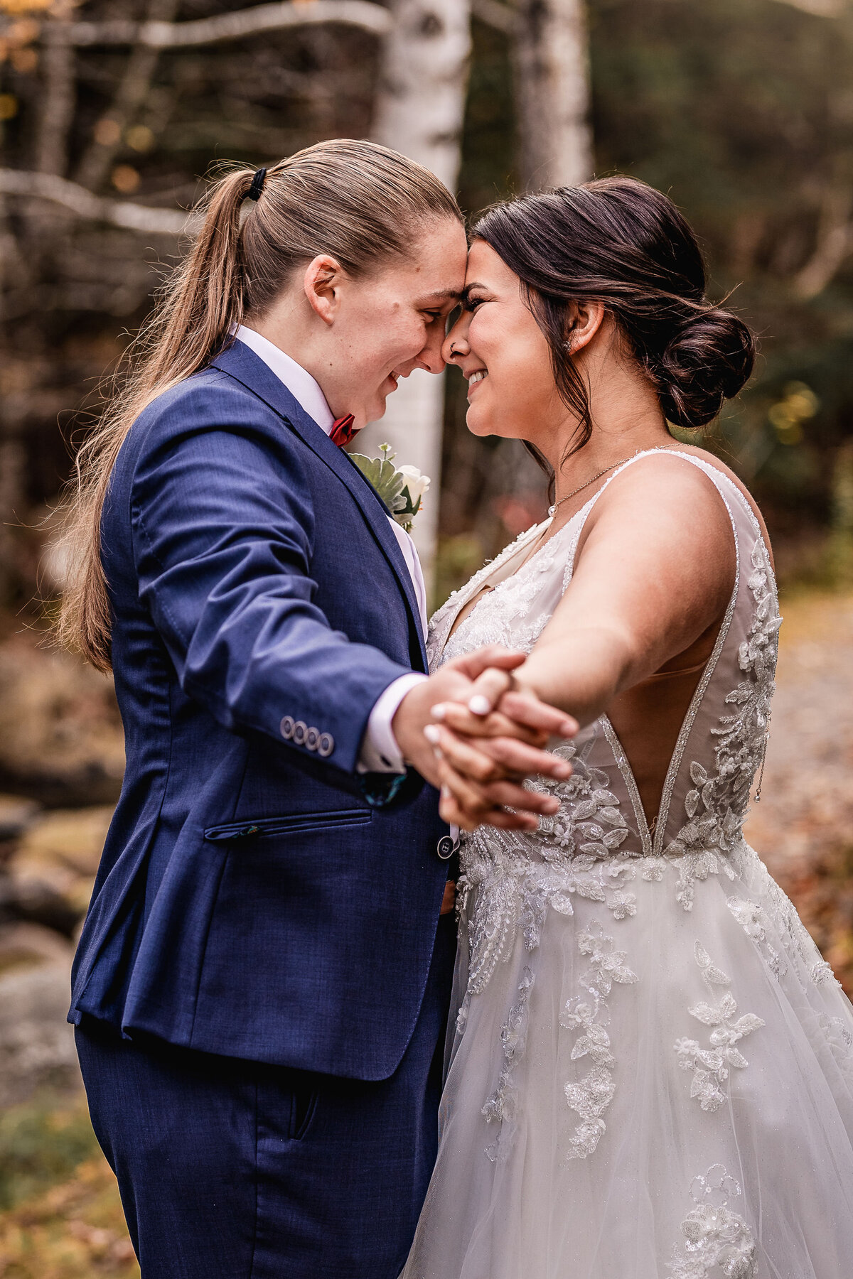 Lesbian couple gazing into each others eyes in town square ar waterville valley resort wedding by Lisa Smith Photography