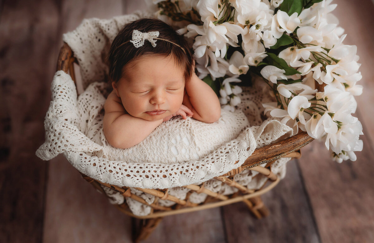 Infant posed for Newborn Photoshoot in Charleston, SC.