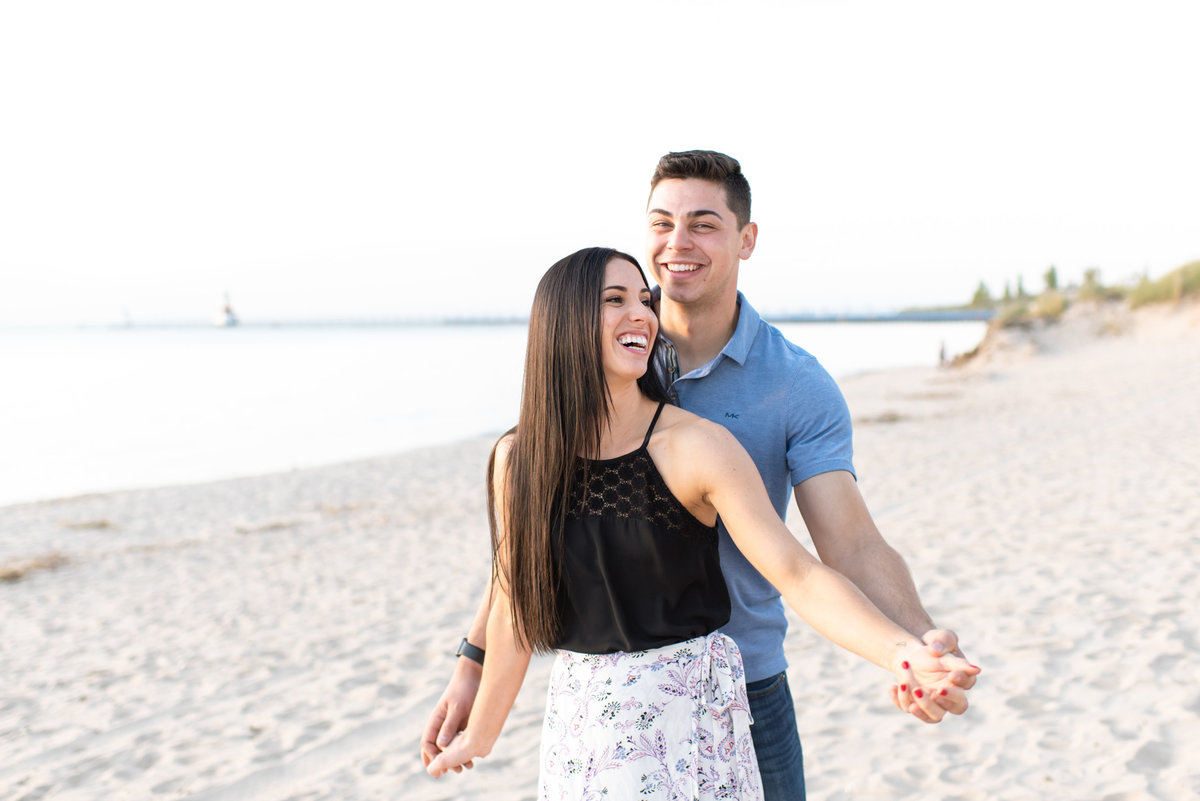 A beach engagement session on Lake Michigan.  Taken by Trisha Marie Photography