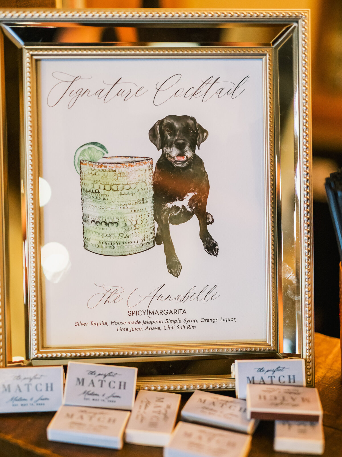 Signature cocktail sign featuring a watercolor dog illustration and custom drink name during a wedding at Old Edwards Inn in Highlands, North Carolina.