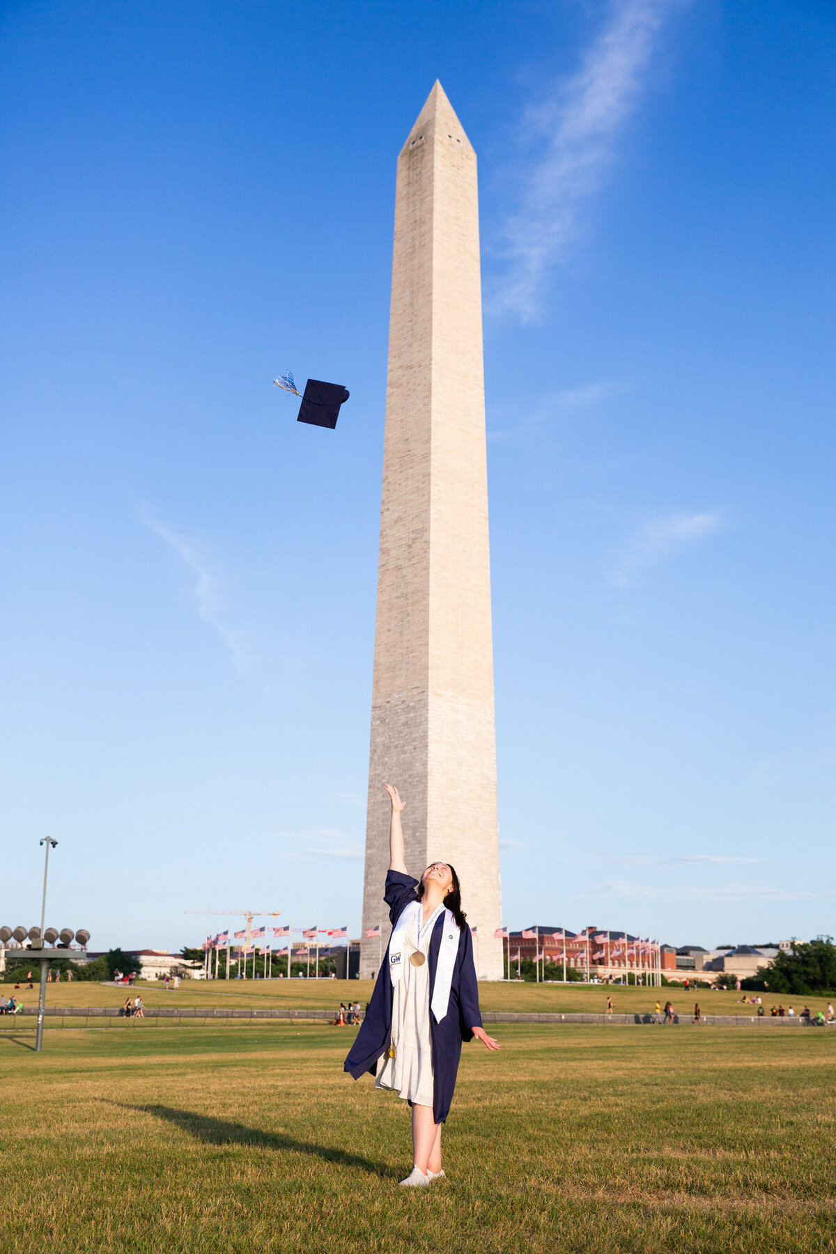 Cap toss college graduation in front of the Lincoln Memorial located in Washington D.C.