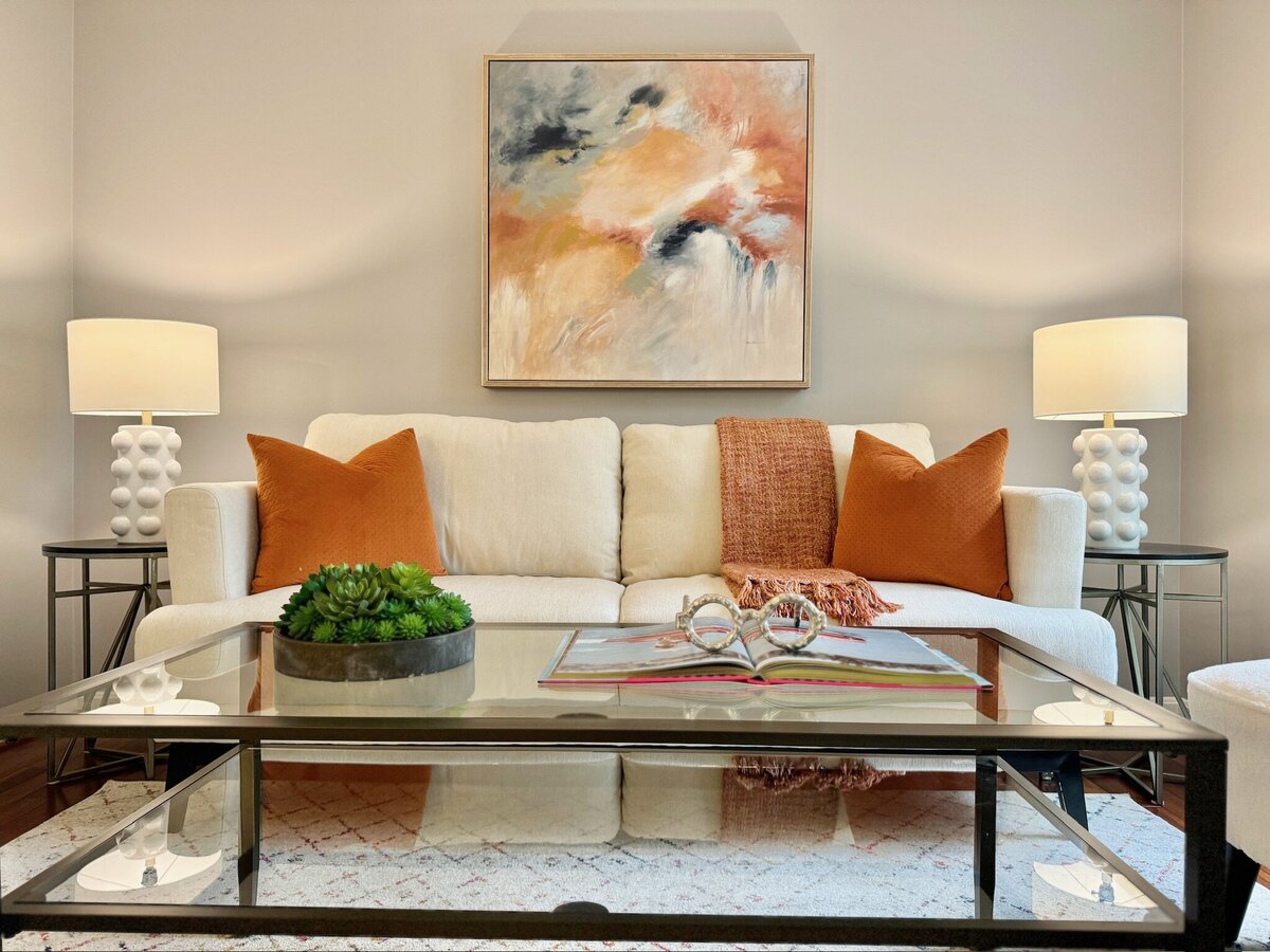 Living room with orange and cream accents