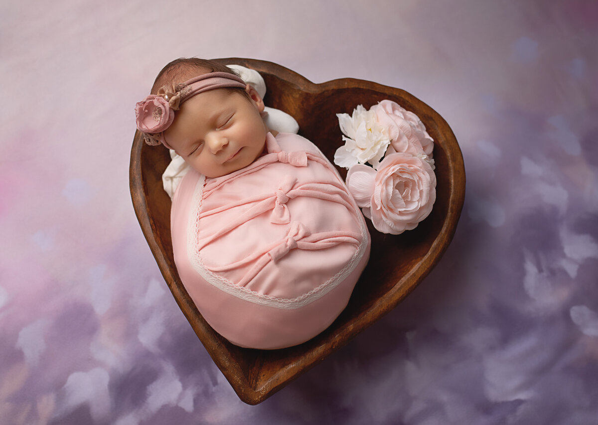 baby in heart bowl