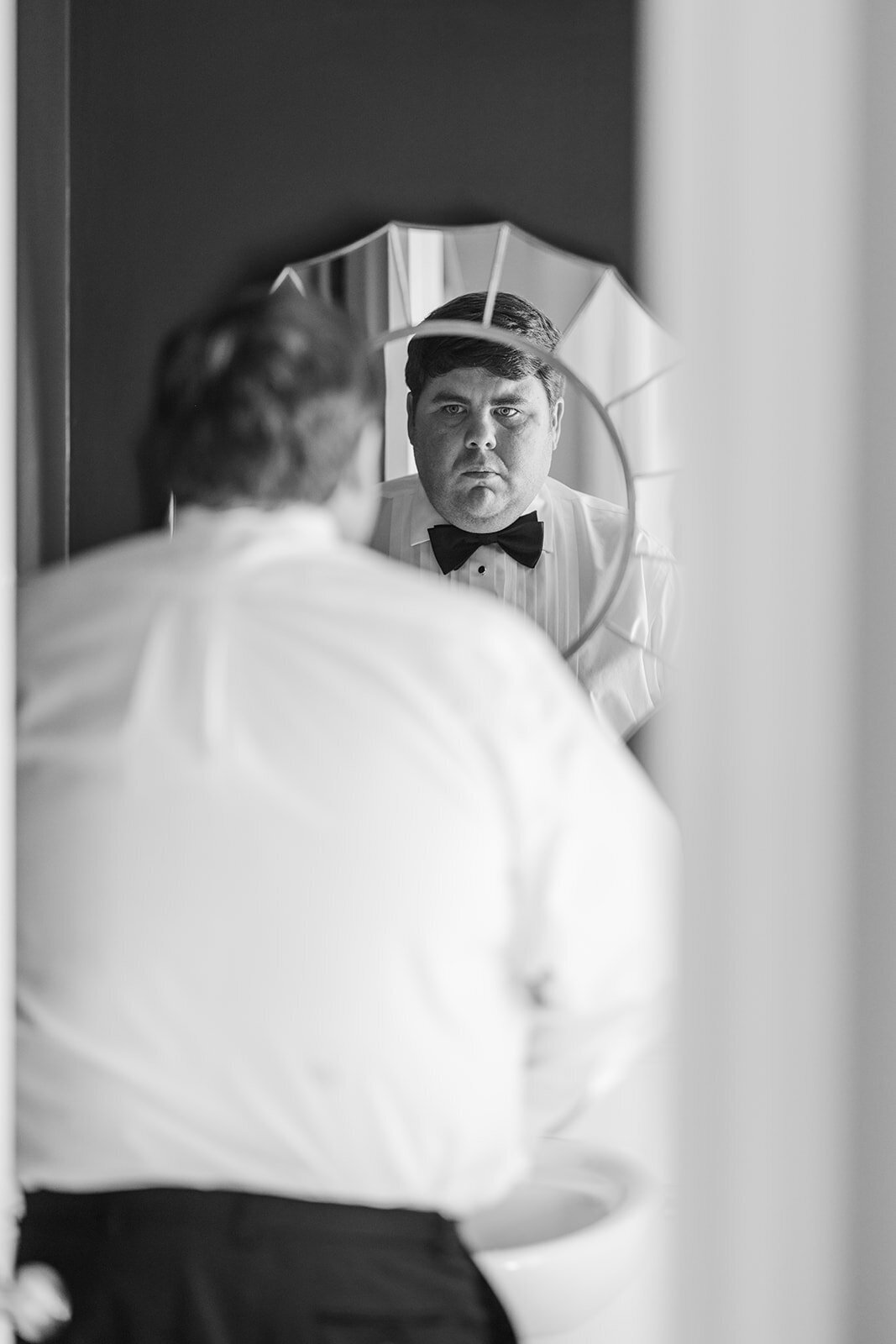 Groom getting ready for his wedding at Christ the King Cathedral Atlanta, GA