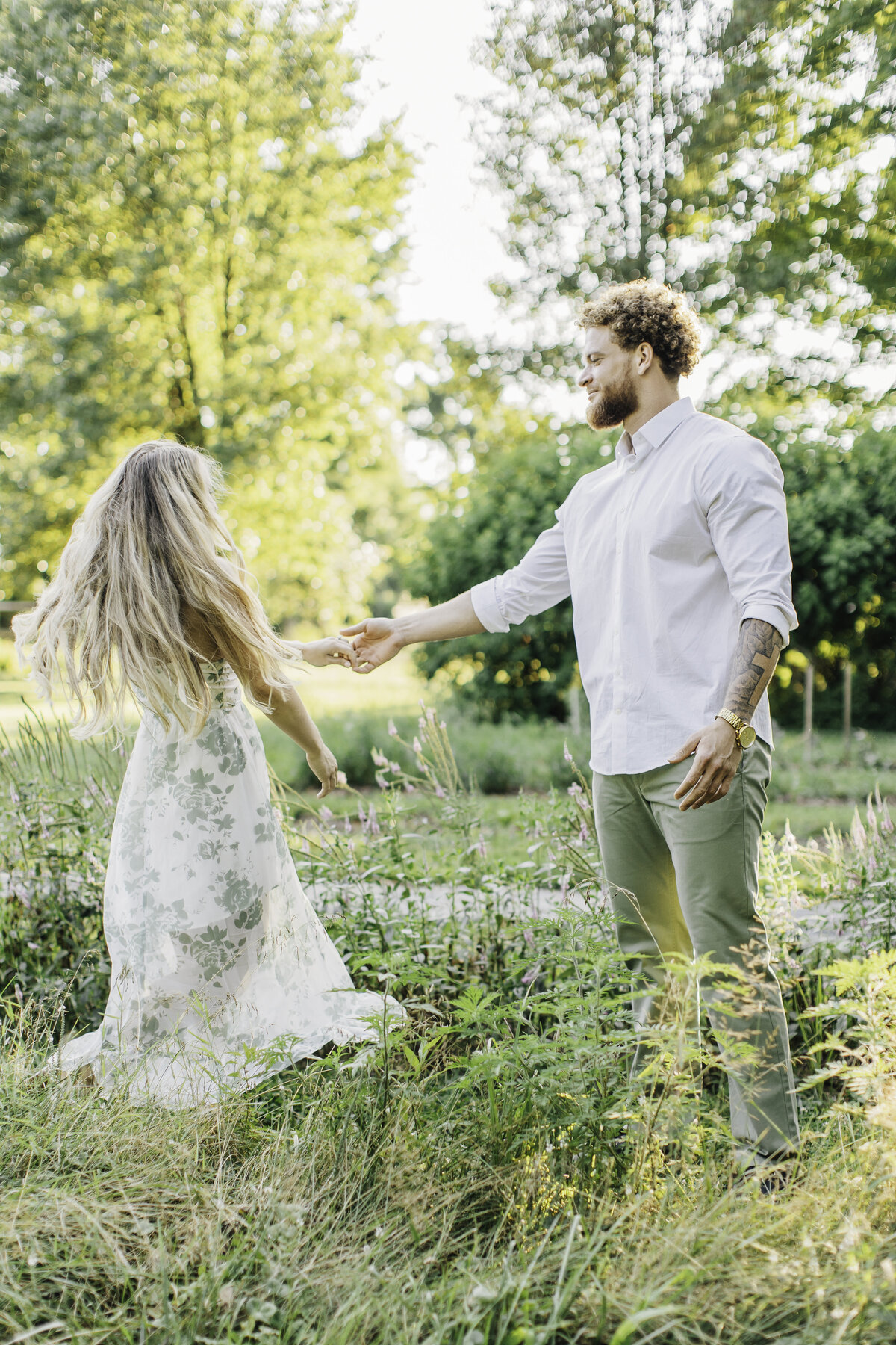 boyfriend dancing with his girlfriend in a garden