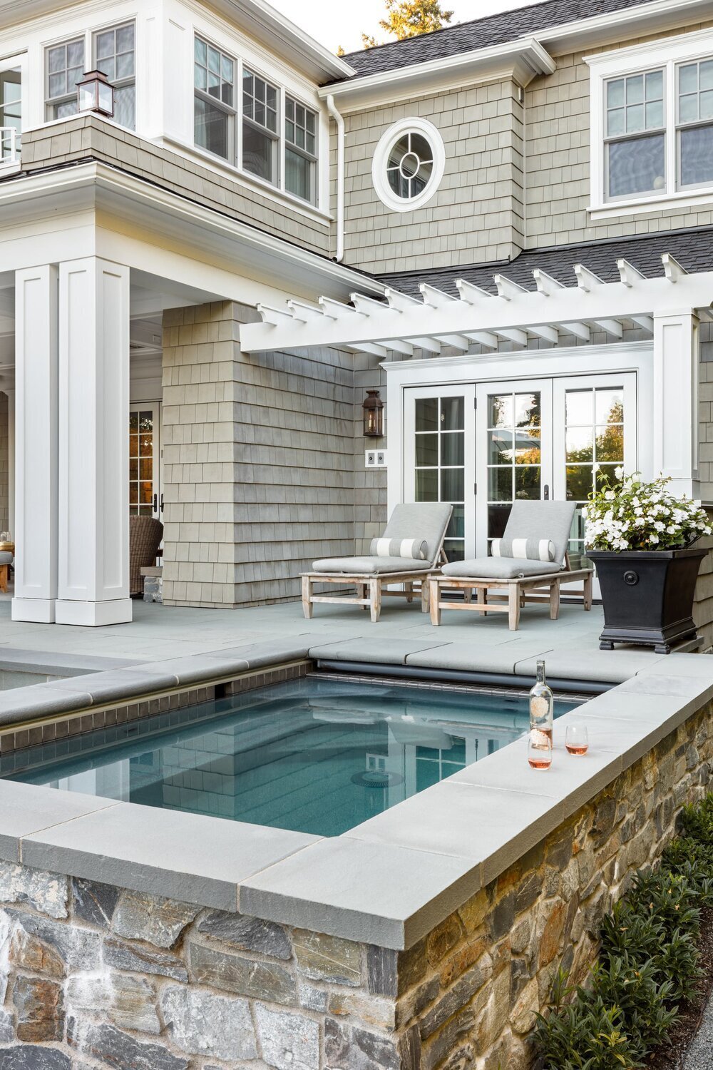 backyard-pool-lounge-chairs-striped-pillows