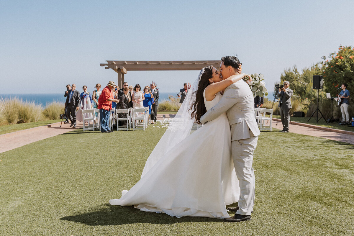 terranea resort wedding ceremony, flower columns, catalina point, first kiss.