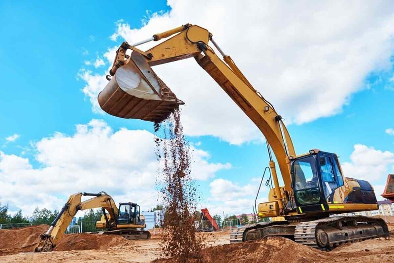 Excavator dumping dirt
