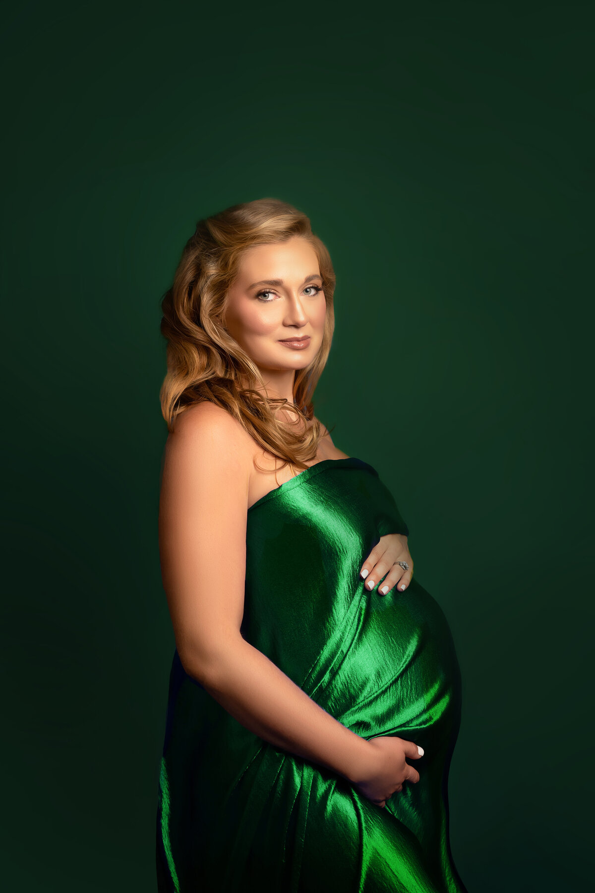 green fabric pregnant belly woman smiling