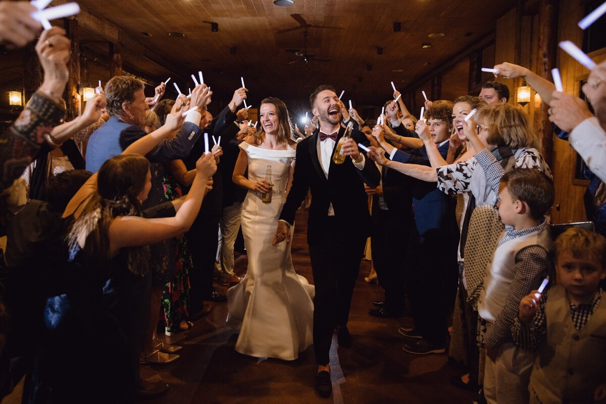 Bride and groom during their grand exit from their wedding reception at Spruce Mountain Ranch.