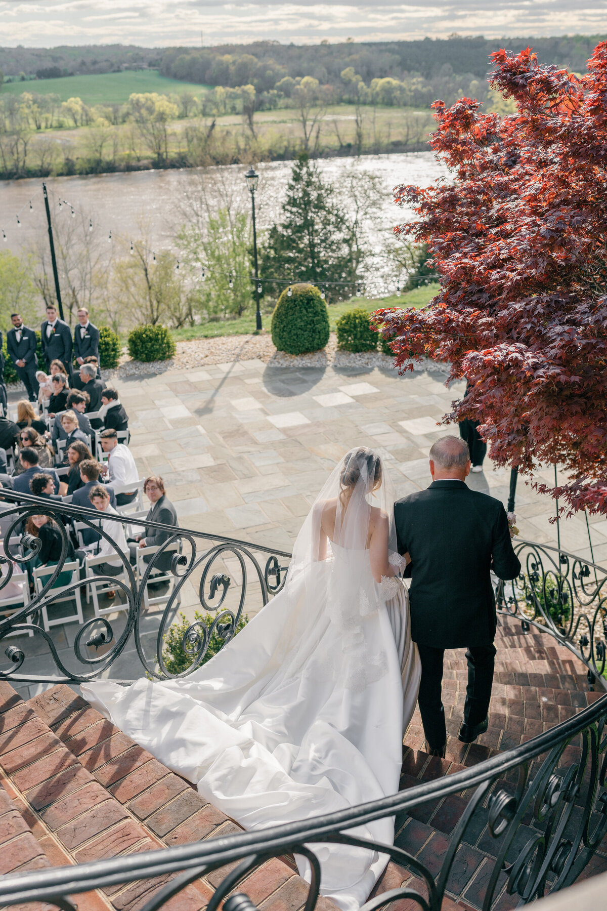 Wedding at the Estate at River Run in Maidens, VA | Wedding Photographer in Richmond | bride and her dad walking down the stairs to the Bluestone Terrace at the Estate at River Run venue