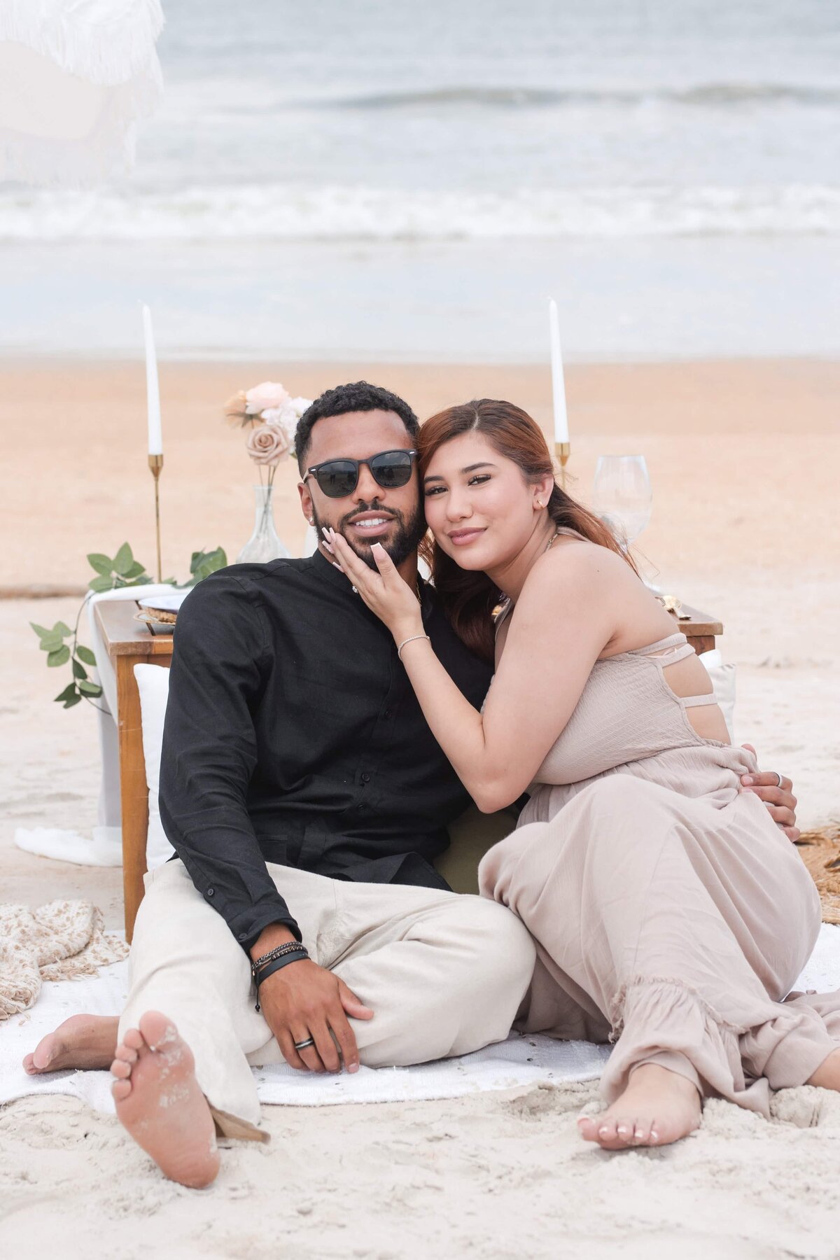 Couple posing after a surprise proposal on the beach | Photo by Phavy Photography, Jacksonville Proposal Photographer