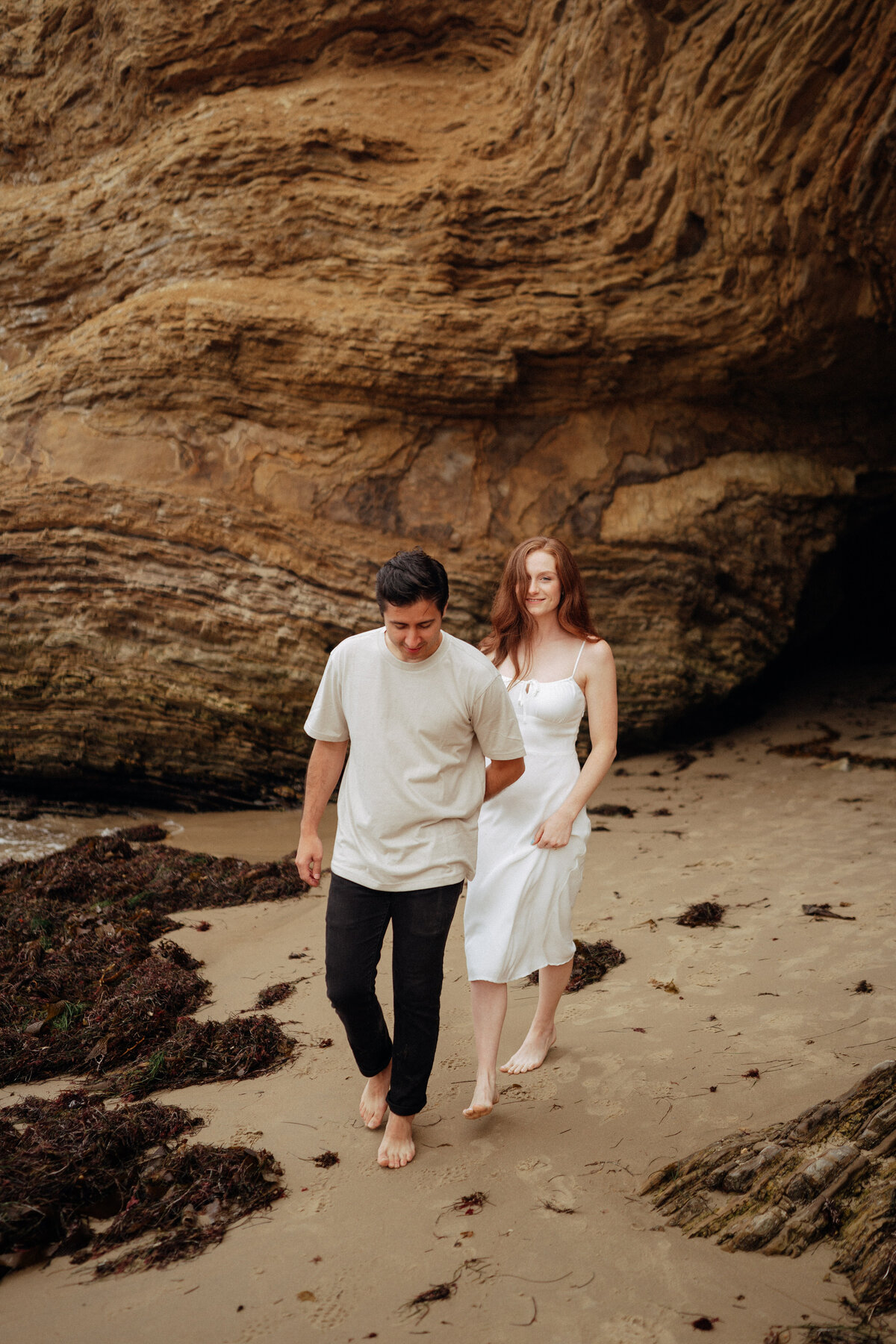 couple shoot for maternity session during golden hour Oregon coast beach wedding/elopement - photographed by The Storytellers