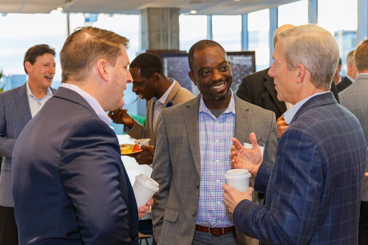 Finance managers talking and networking during a CFO forum event in Midtown Atlanta by Laure Photography