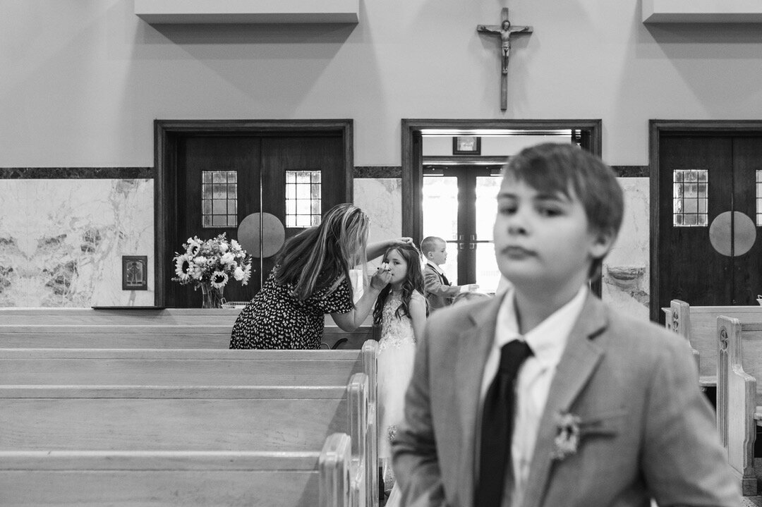 child looks to the camera in a church