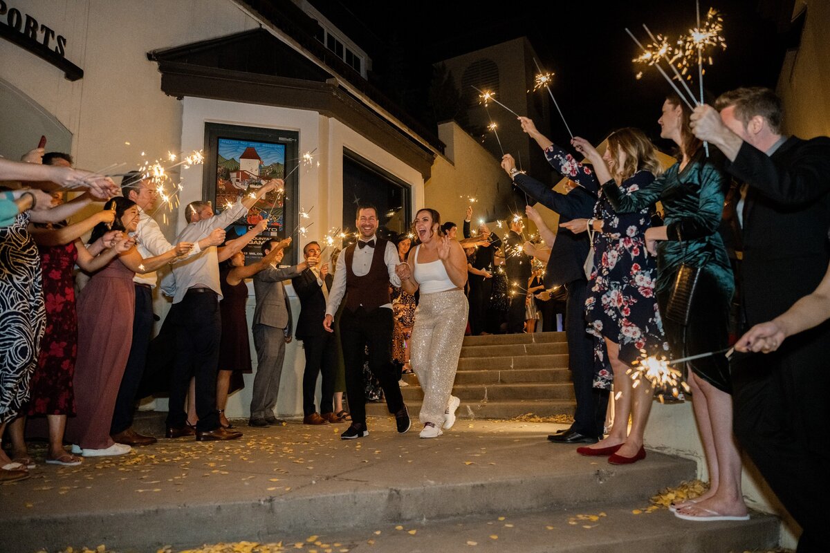 Bride and groom during their sparkler exit in Vail, Colorado.