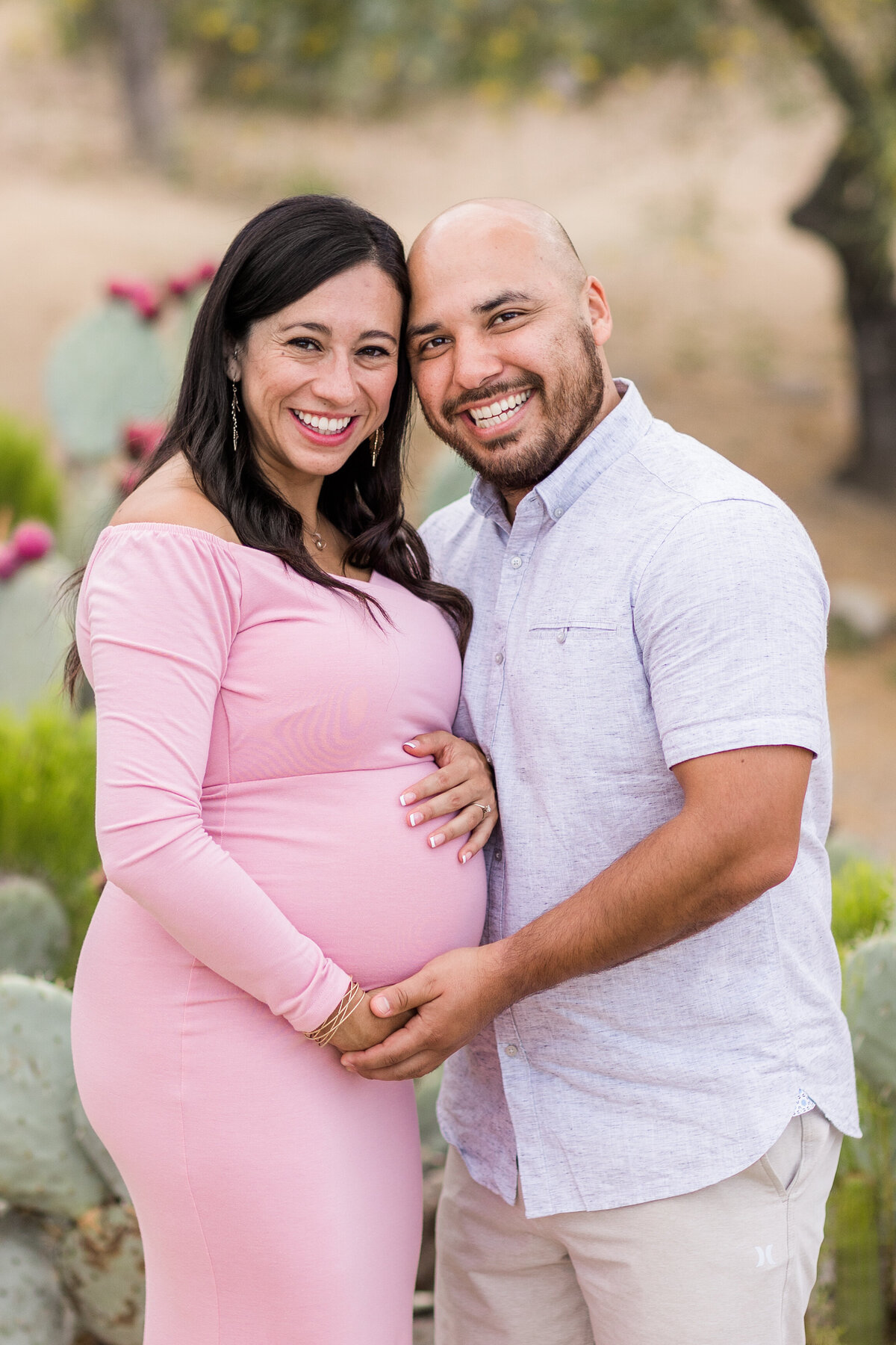 man and Pregnant woman laughing together