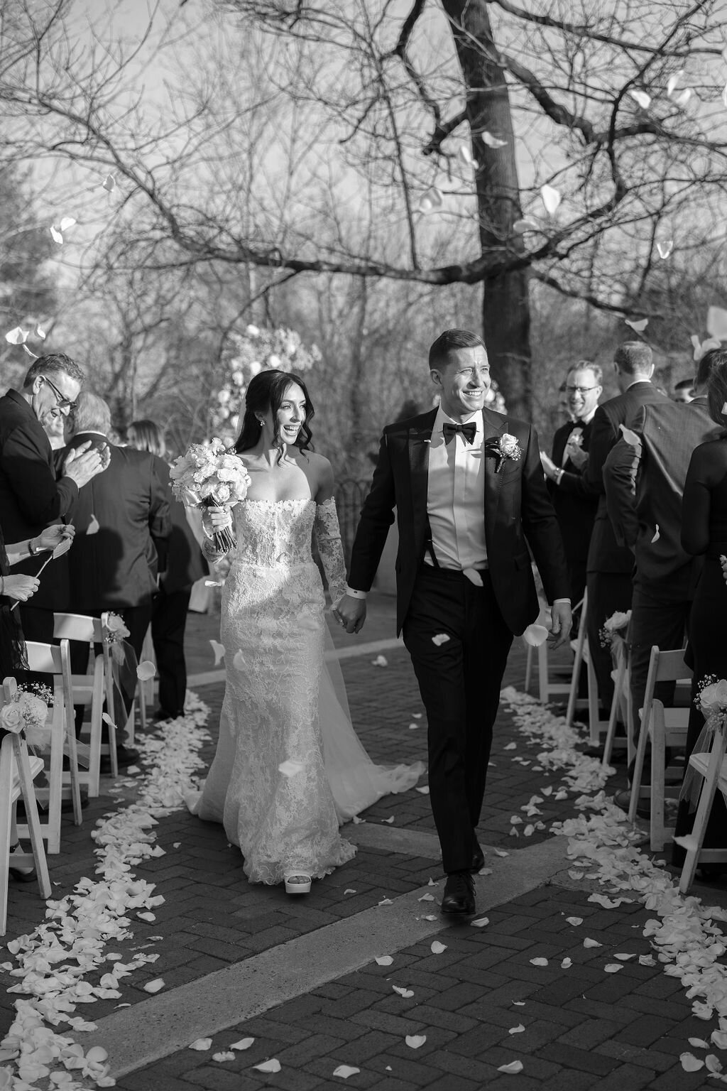 Bride and groom walk down the aisle at the Hotel Du Village
