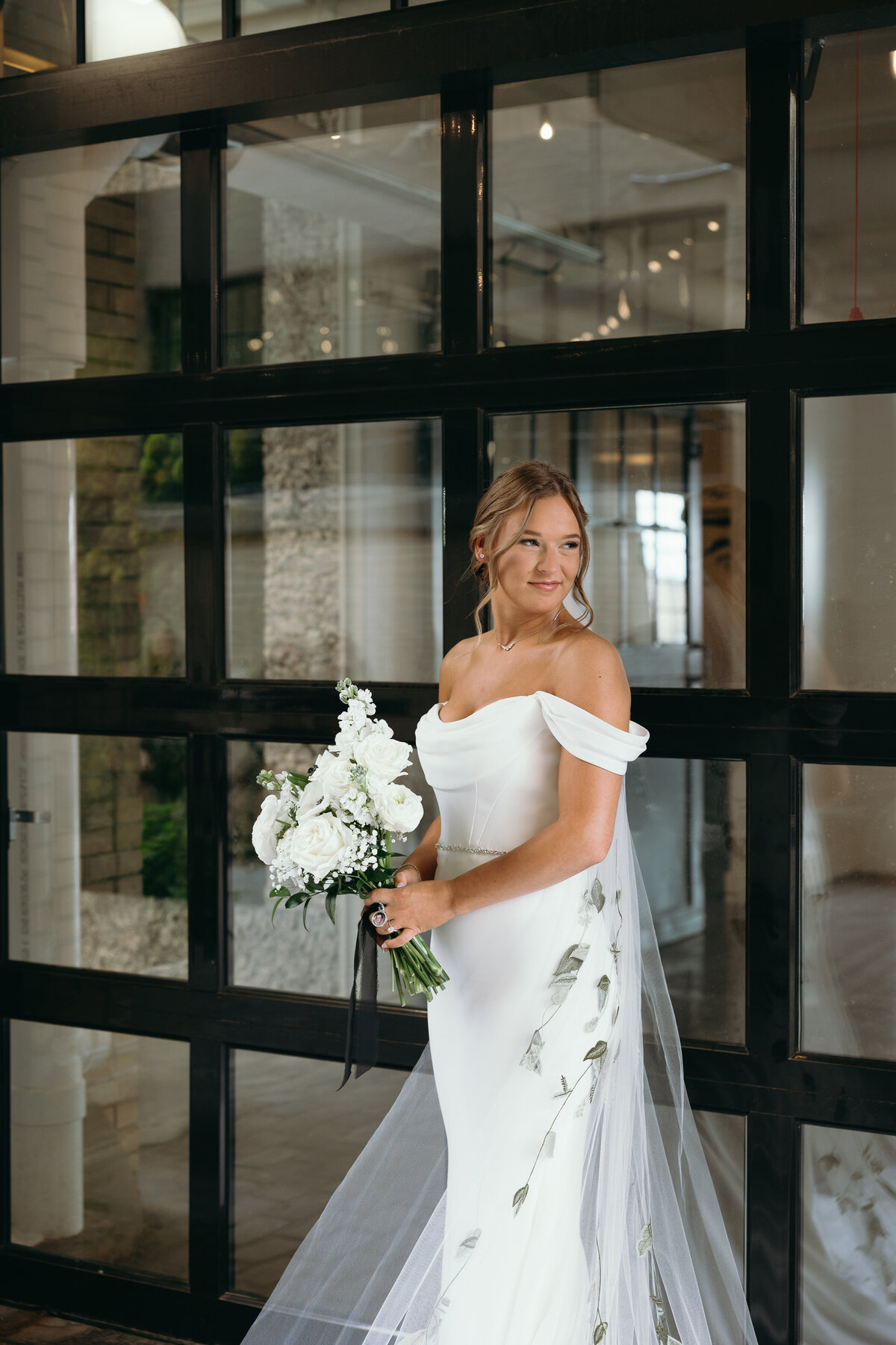 Ryann photographing a couple, bringing authenticity and warmth to wedding photography in Indiana and beyond.