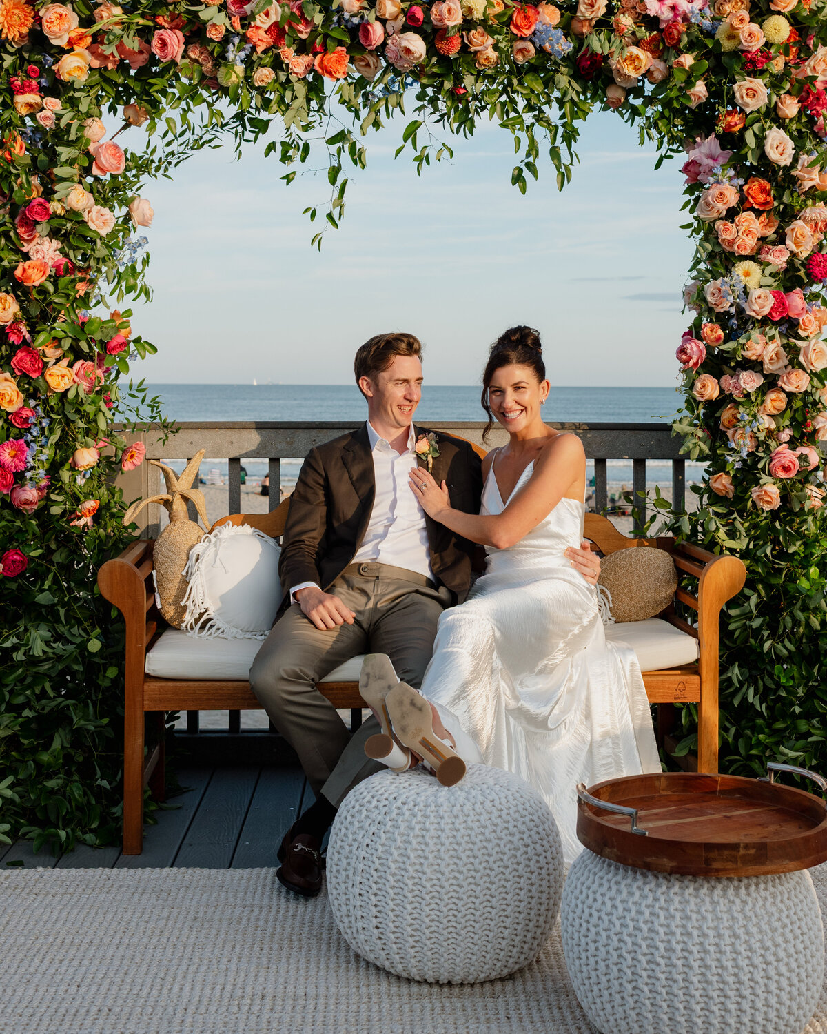 Couple laughing in front of the ocean at Dunes Club wedding in Narragansett
