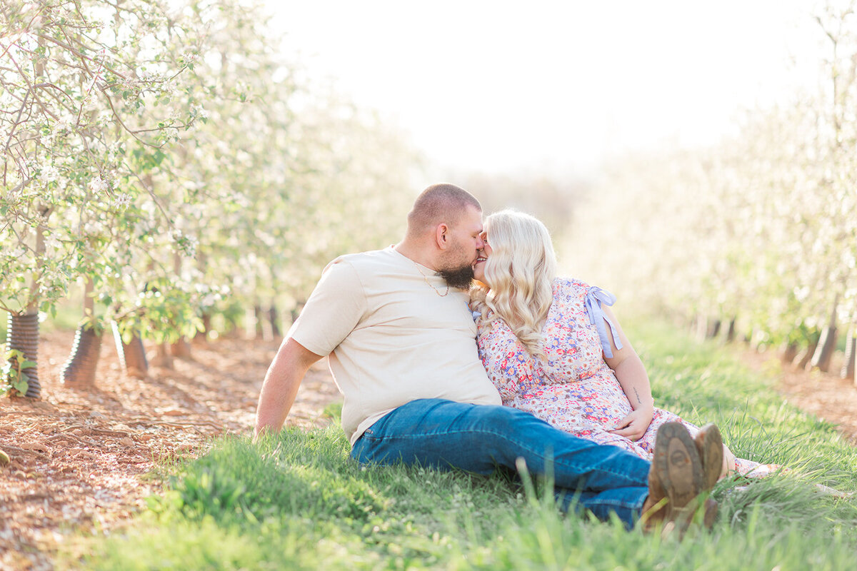 Natural and heartfelt maternity images with blooming apple trees