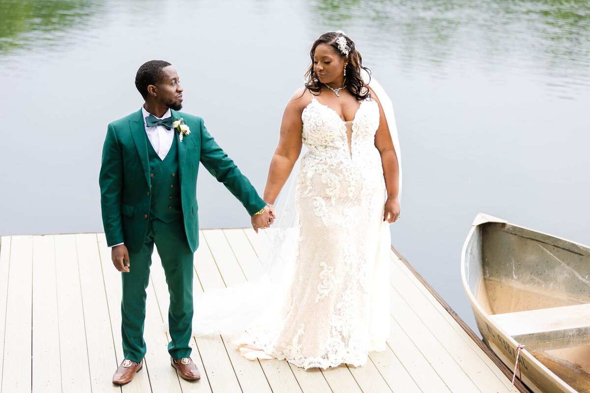 Black married couple standing on the dock at Splendor Pond