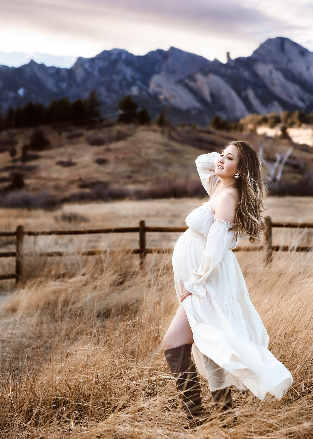 Amazing pregnancy photography in Boulder colorado field at sunset in the winter