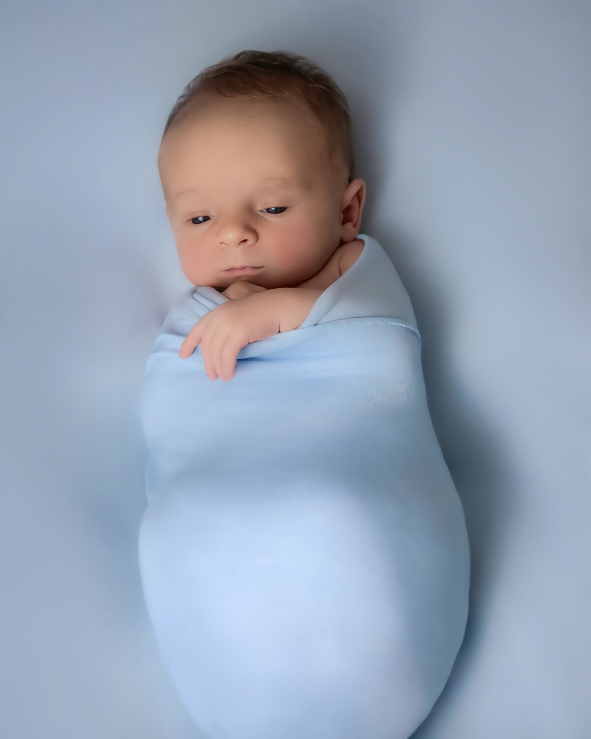 Baby boy in blue wrap