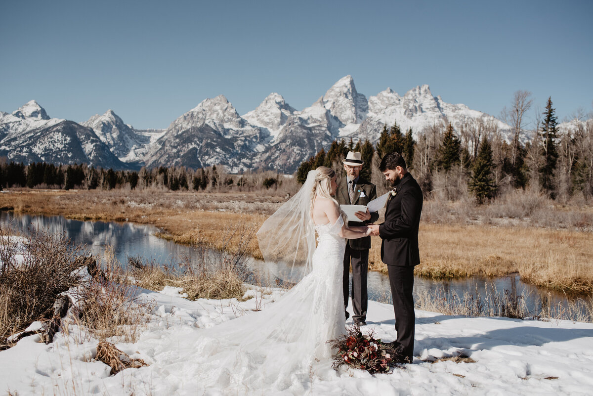 Jackson Hole Photographers capture couple standing with officiant during Grand Teton elopement
