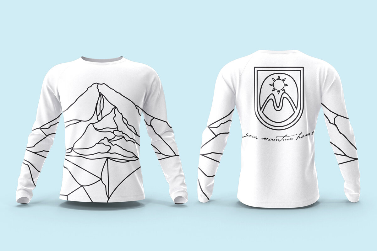 A long sleeve shirt with design by Ayanna Richilano Designs in b&w with the stained glass style Mt.Hood artwork created by Ayanna Richilano Designs promoting the suits 'n boots event at Mt.Hood Meadows
