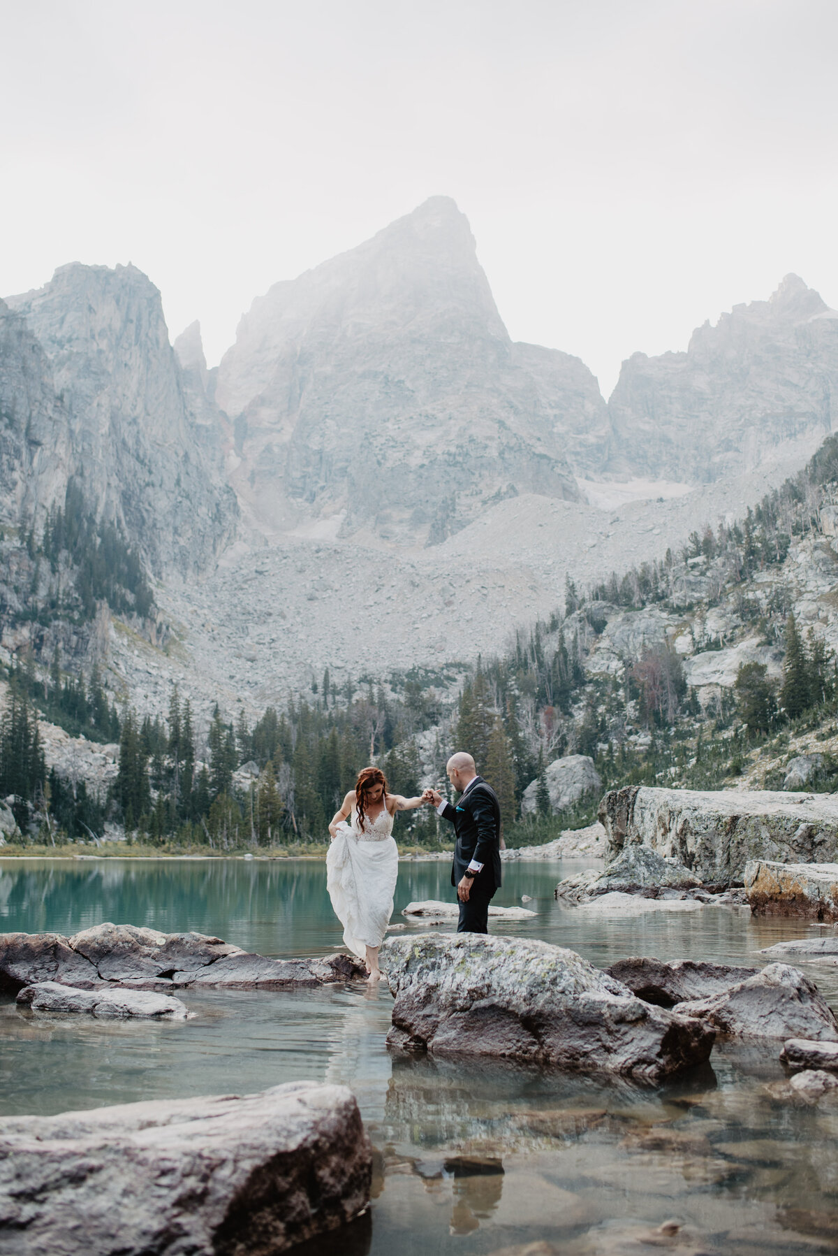 Jackson Hole Photographers capture couple walking on rocks together