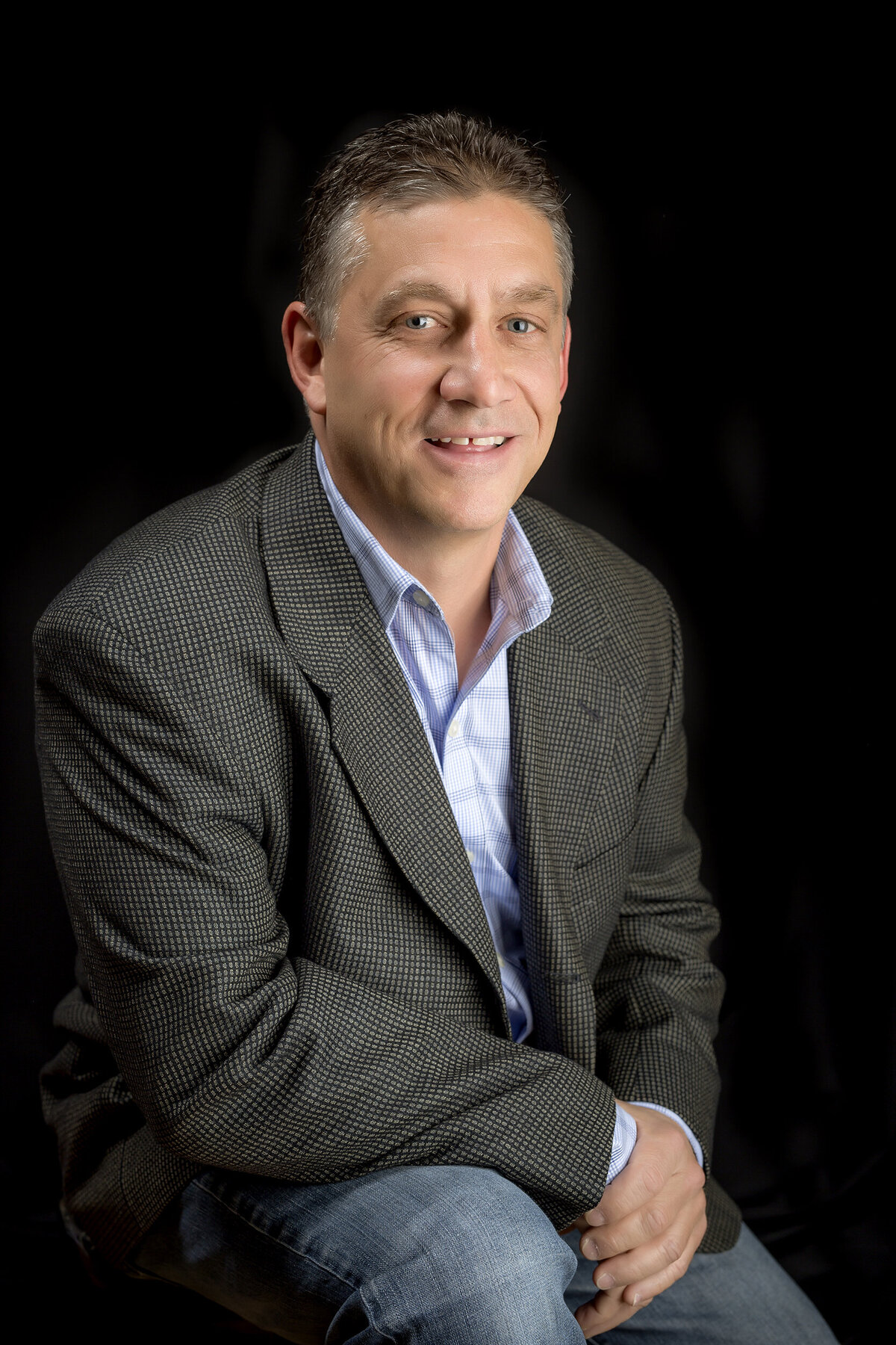 Male corporate headshot client wearing a suit coat for realtor office