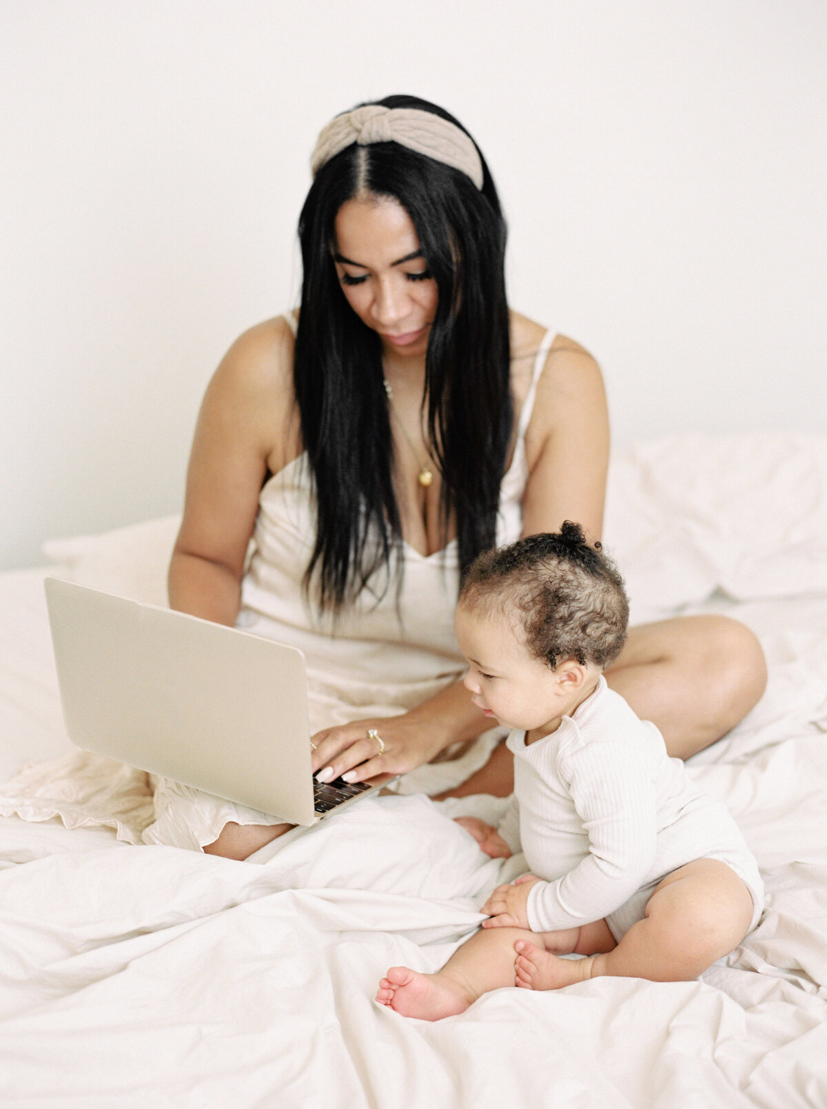 an image of a working mom with baby on a therapy website for moms of color