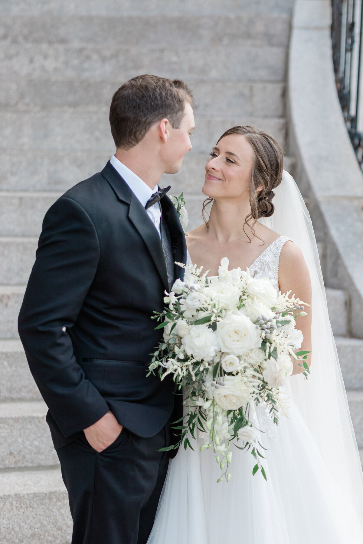 A bride and groom share a moment together after their wedding
