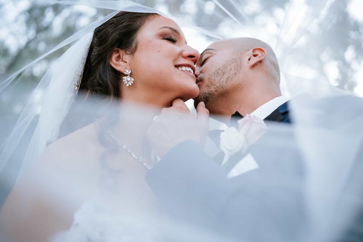 Veil shot od bride and groom captured by Orlando Wedding photographers