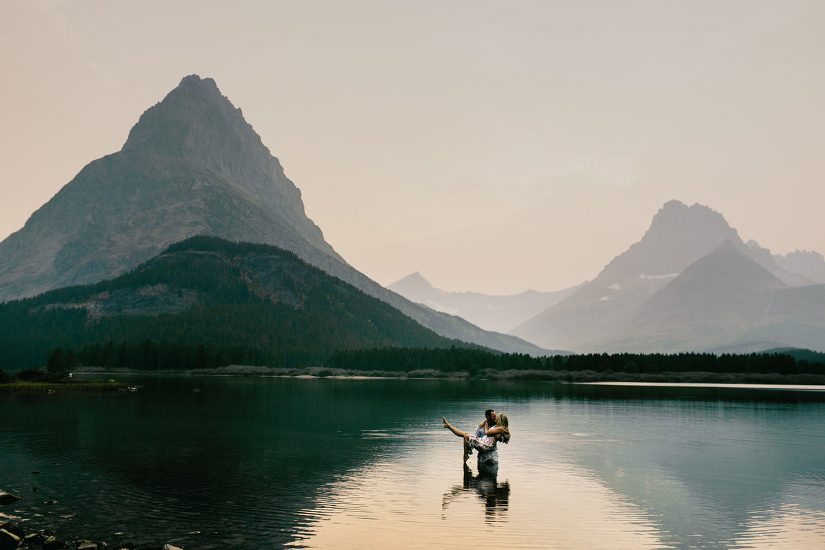 man holding woman in lake