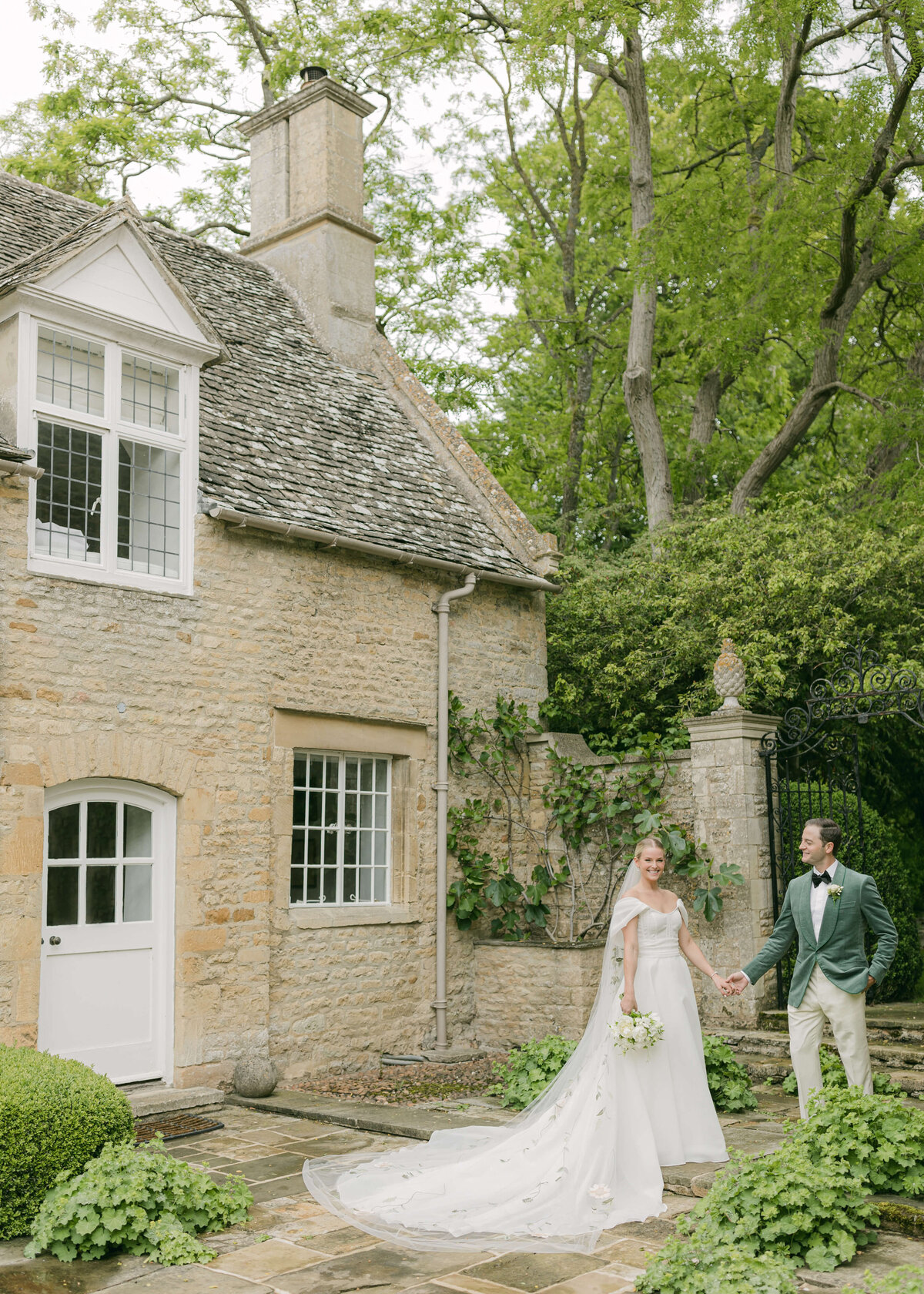 chloe-winstanley-weddings-cotswolds-cornwell-manor-monique-lhuillier-dress-green-suit-portrait