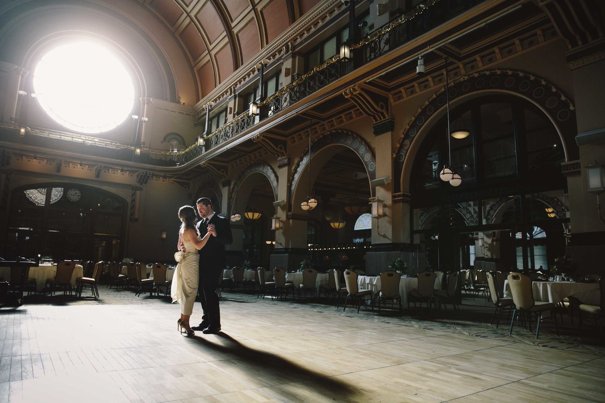 Couple dances in the middle of union station crowne plaza wedding