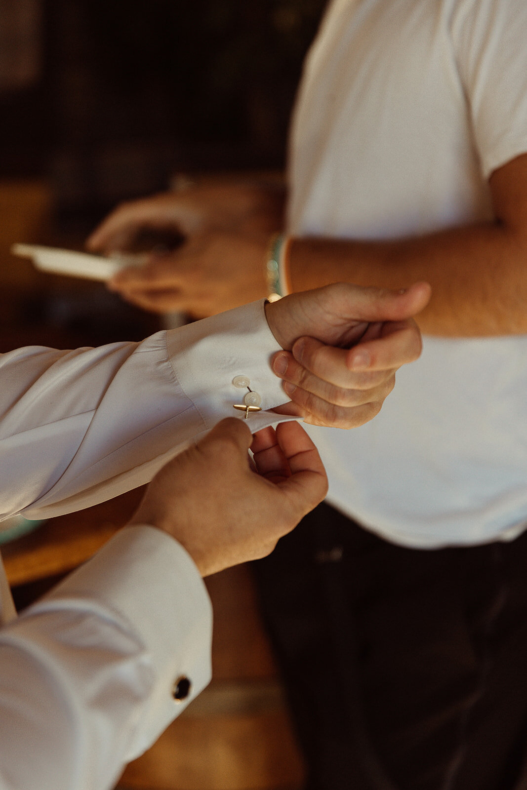 groom-putting-on-cufflinks