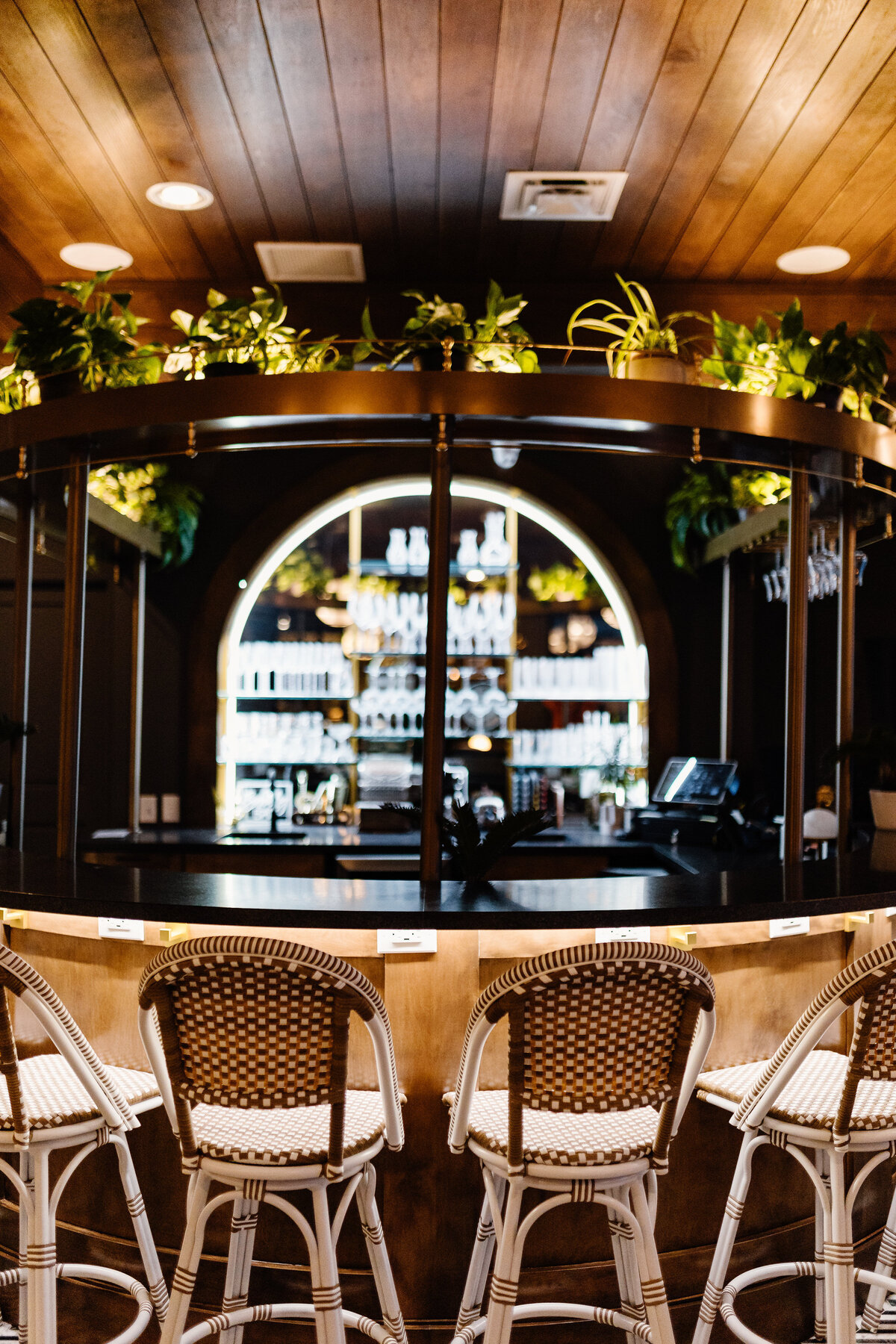 A bar at a restaurant with no one sitting down